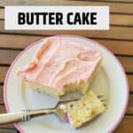 Square slice of yellow cake with strawberry frosting