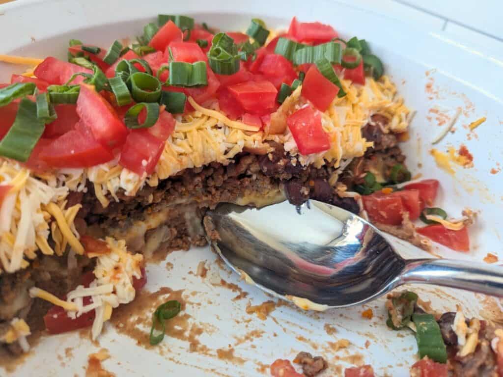 Image shows almost finished portion of nontraditional 7 layer dip.