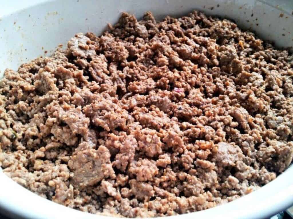Image shows ground beef layer above the black bean layer.