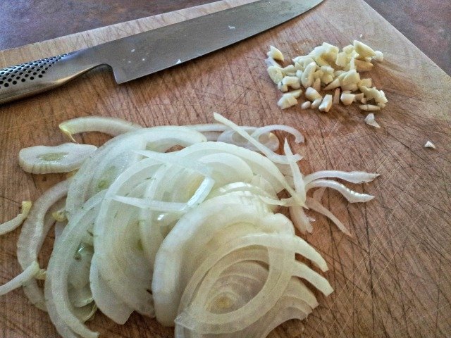 Slice your onions and garlic for the pulled pork