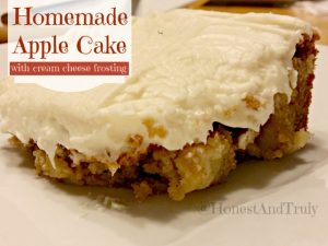 Enjoy homemade apple cake with cream cheese frosting. This simple cake bakes in a 13x9 pan and is a great unique cake recipe. #apple #cake #creamcheese #fromscratch