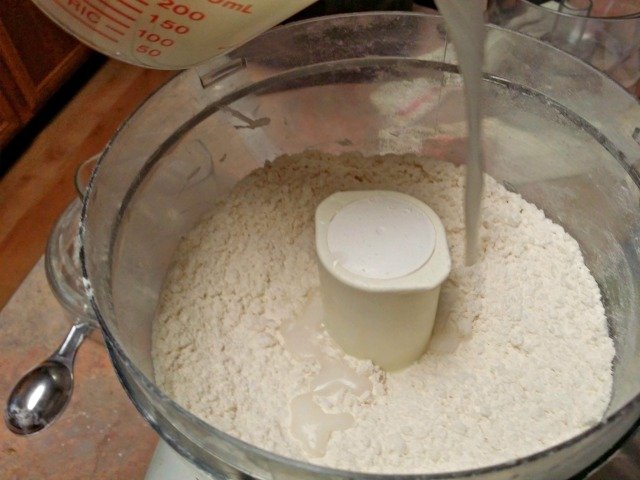 Milk poured onto biscuit dough
