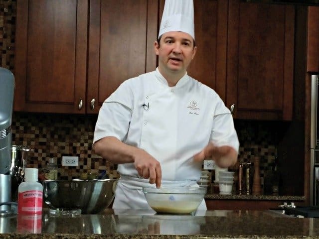 Joel from the French Pastry school making macaroon batter