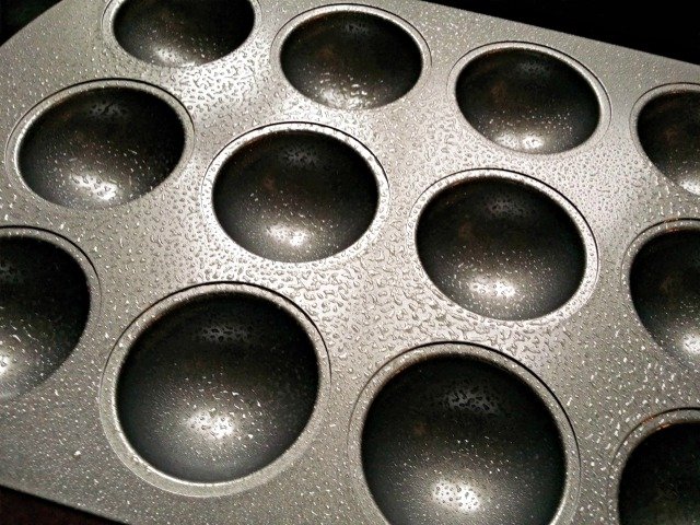 Lightly greased Wilton orb mini cake pan