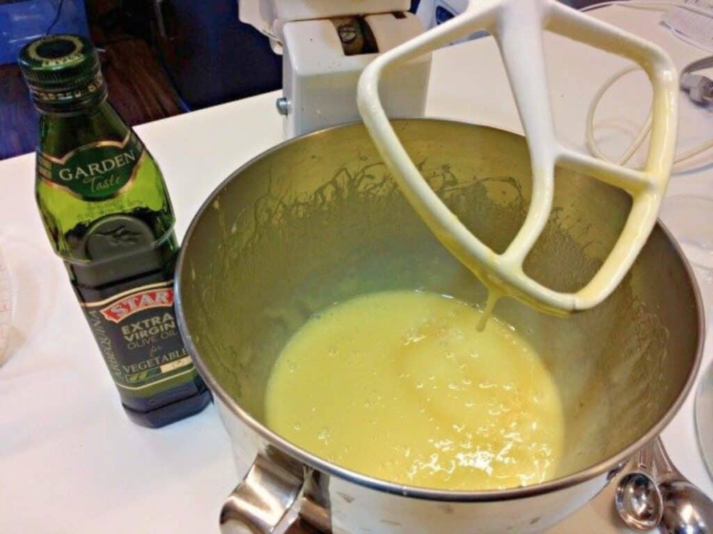 Image shows other ingredients whipped together for chocolate olive oil cake.