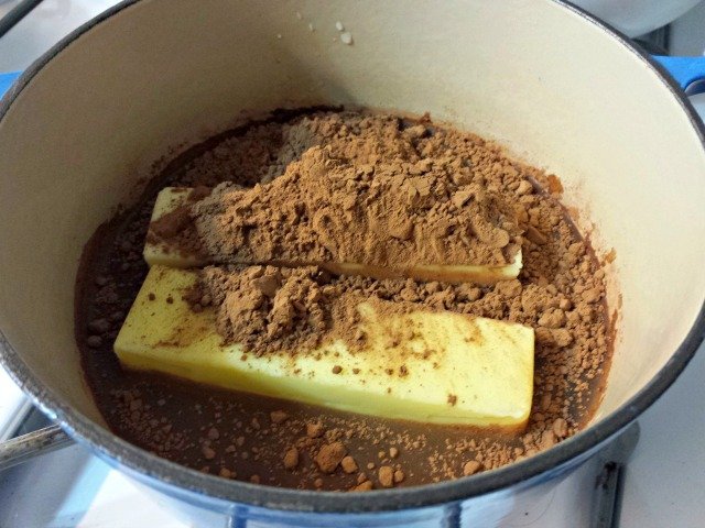 Melt butter cocoa with water for Mexican sheetcake brownies
