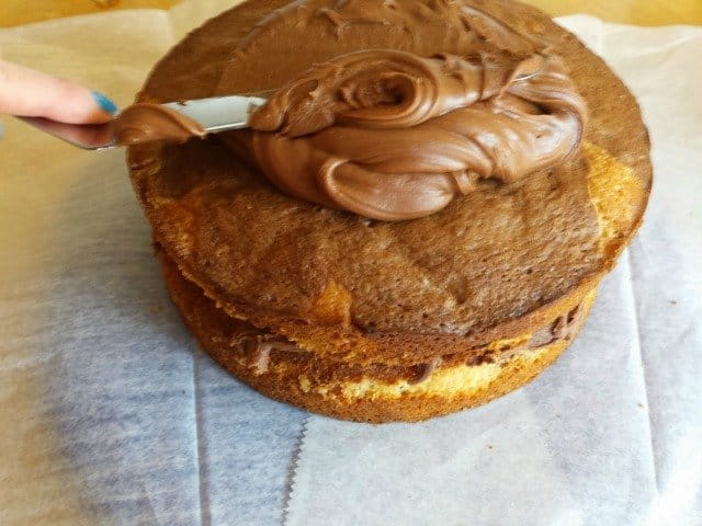 Spread frosting from the center of your cake