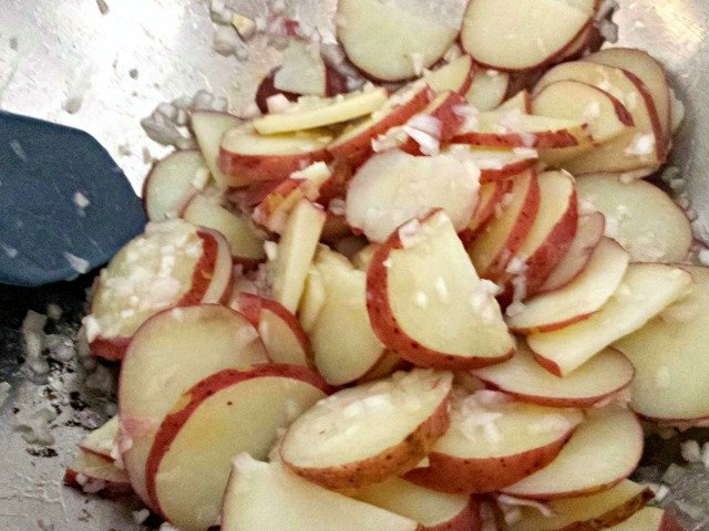 Adding ingredients to French potato salad