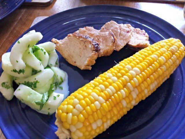 Enjoying a plate of kefir marinated chicken and cucumber salad