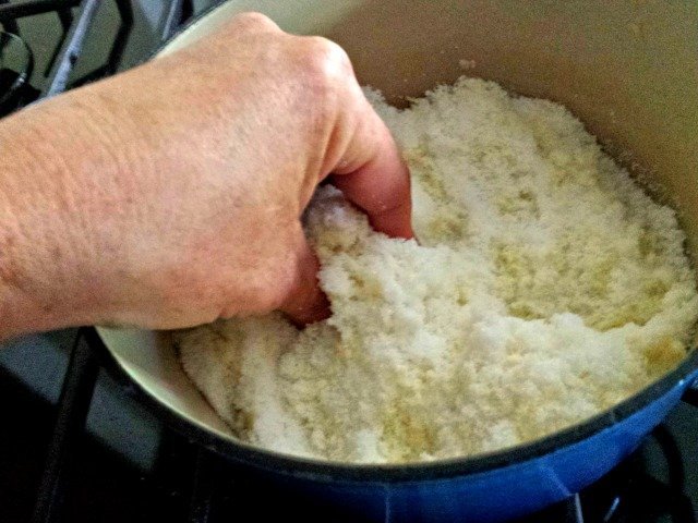 Use your fingers to squish together lemon zest and sugar to make lemon sugar
