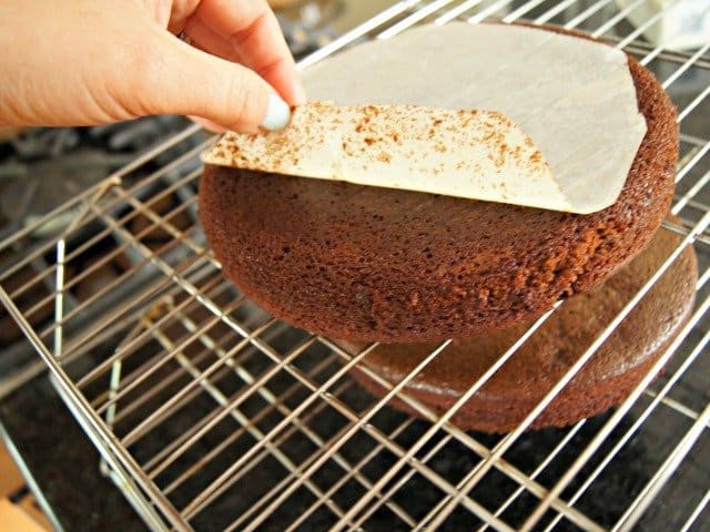 Remove parchment paper from bottoms of cakes once you turn them out