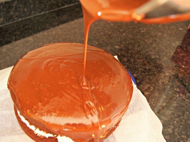Pour ganache onto the center of your cake