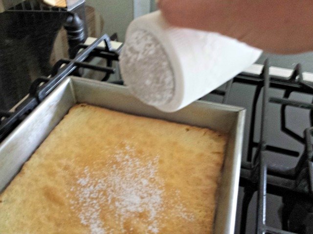Sprinkle lemon squares with powdered sugar