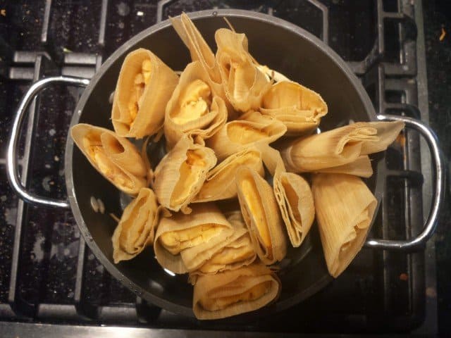Cook tamales be steaming