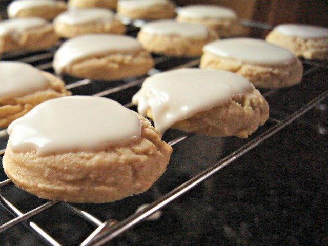 Glazed chewy lemon cookies on the cooling rack