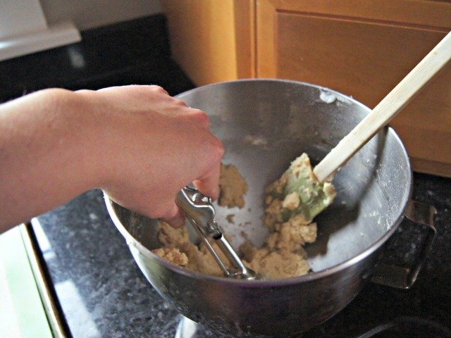 Scooping chewy lemon cookies