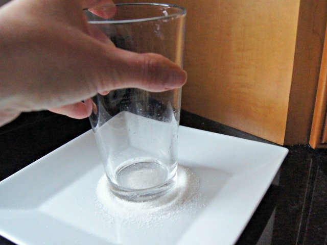 Dip a glass in sugar to keep it from sticking