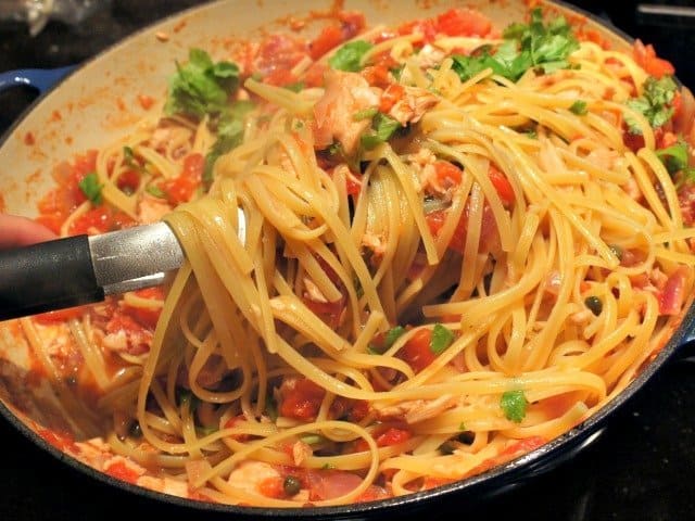 Gently tossing pasta