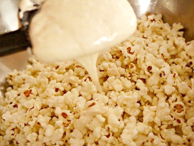 Drizzle marshmallow over popcorn