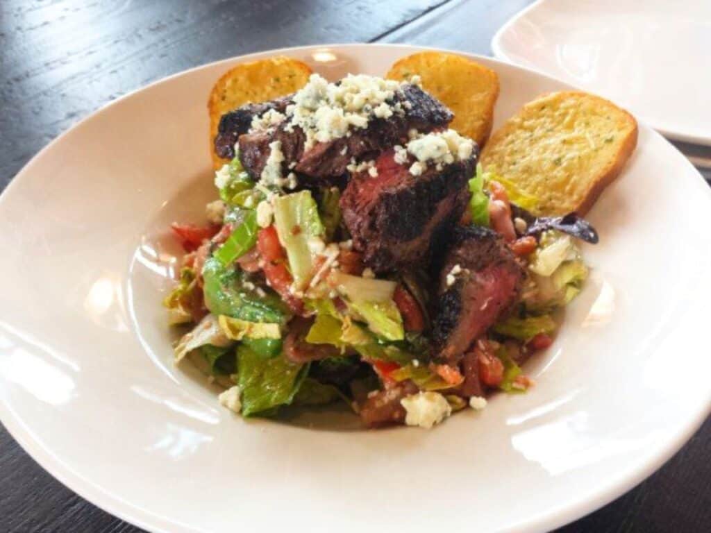 Image shows Steak salad.