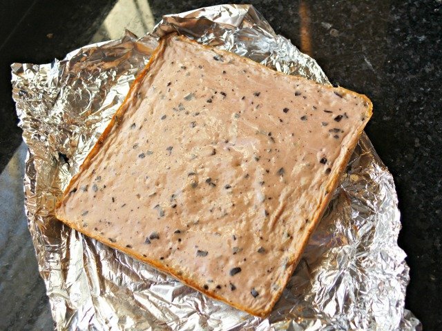 Remove foil from frozen cheesecake