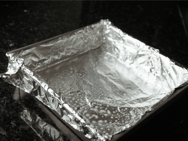 Prepping the cheesecake pan
