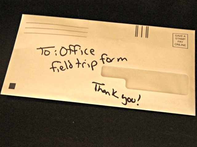 Using a recycled envelope for school notes