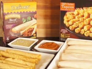 Delimex taquitos and tamales with homemade mole and roasted tomatillo salsa