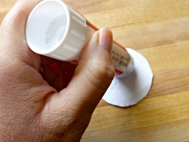 Apply glue to thank you gift card tag printable