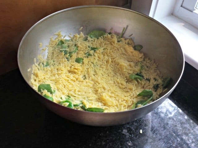Coat spinach with hot orzo