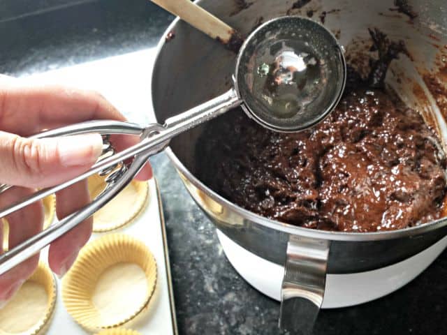 Scoop muffins with greased scooper