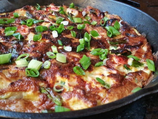 Add green onion to nicoise dinner omelet before serving