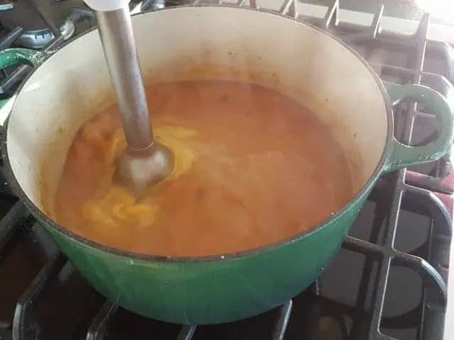 Blend cheese and sausage soup to puree