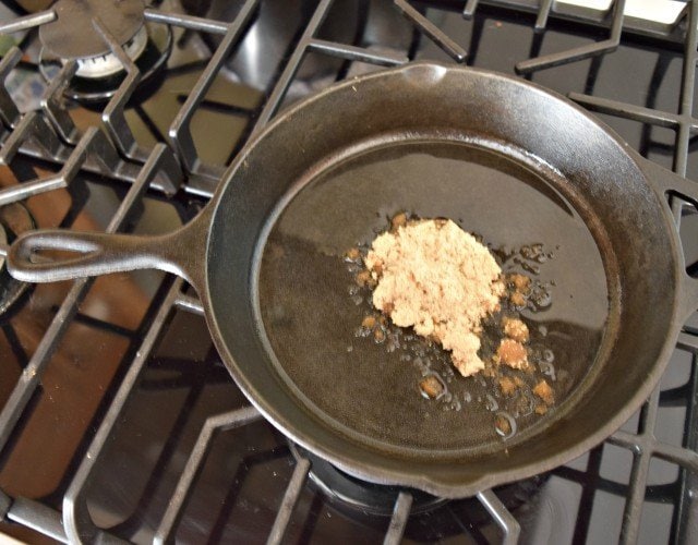 Melt butter then add brown sugar to cast iron skillet
