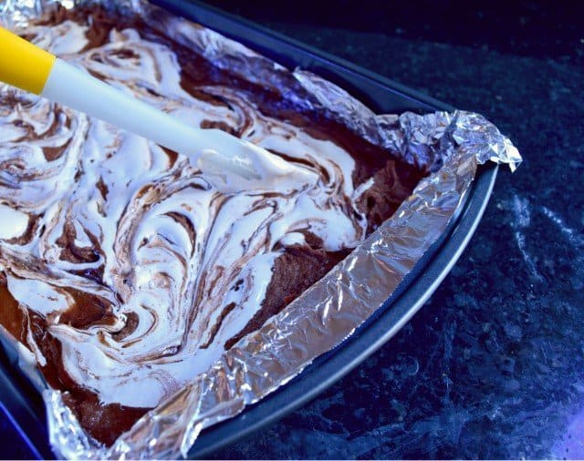 Swirl marshmallow fluff gently into brownie batter for smores brownies