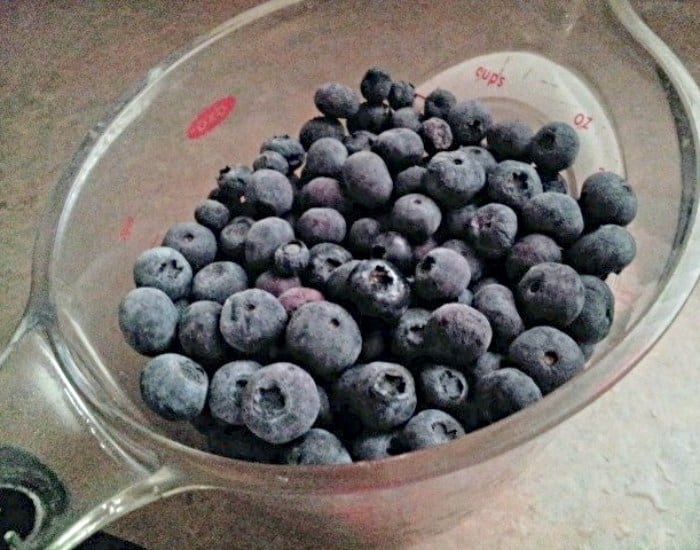 Measuring blueberries for syrup.