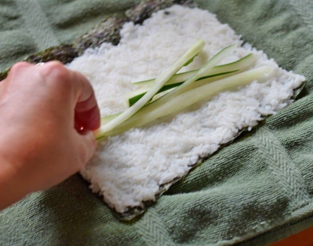 Add thinly sliced cucumber