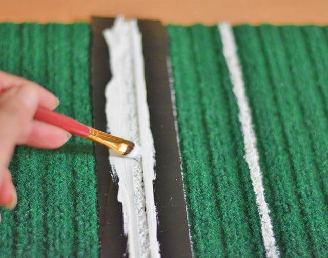 Paint yard markers on green mat