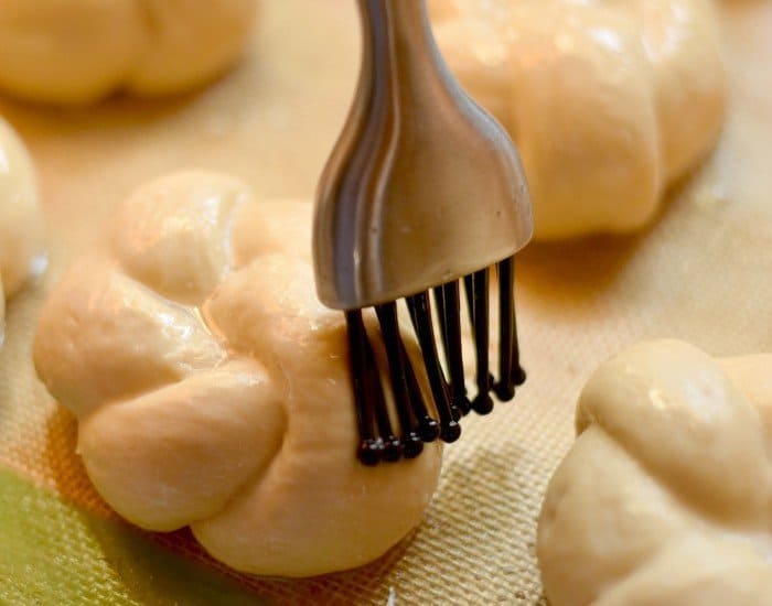 Brush tops of rolls with butter