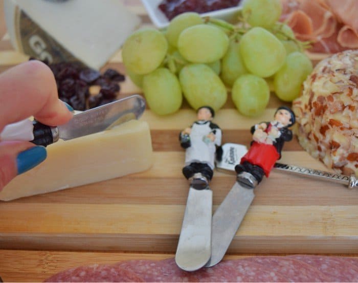 Cutting into a cheese platter