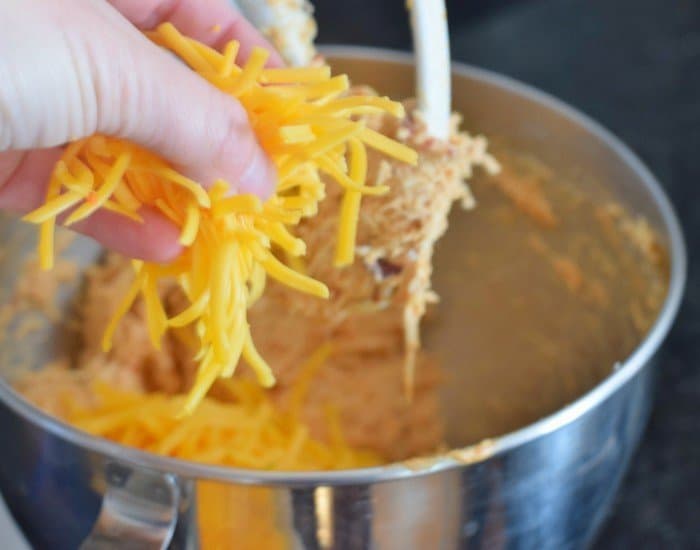 Add freshly grated cheddar cheese