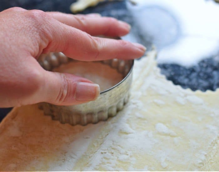 Use a biscuit cutter to make empanadas