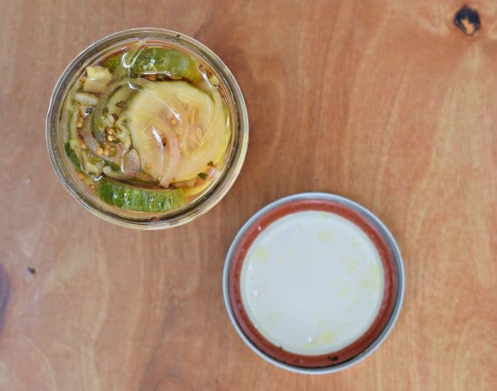 Jar of homemade pickles garlicky bread and butter pickles