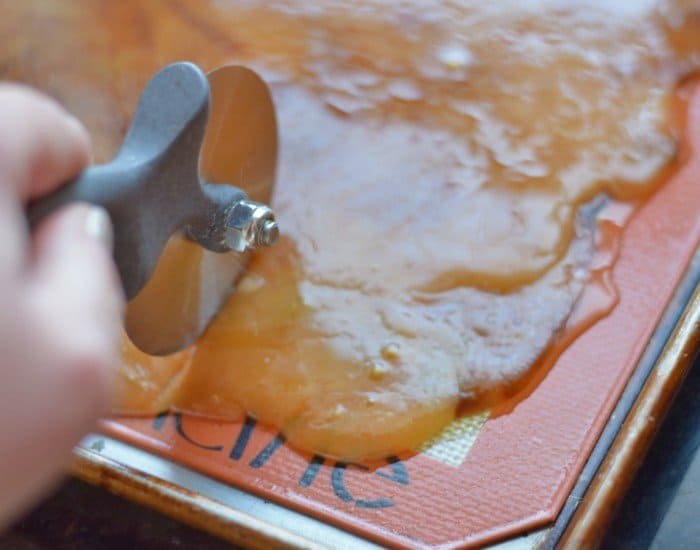 Use a pizza cutter to score toffee