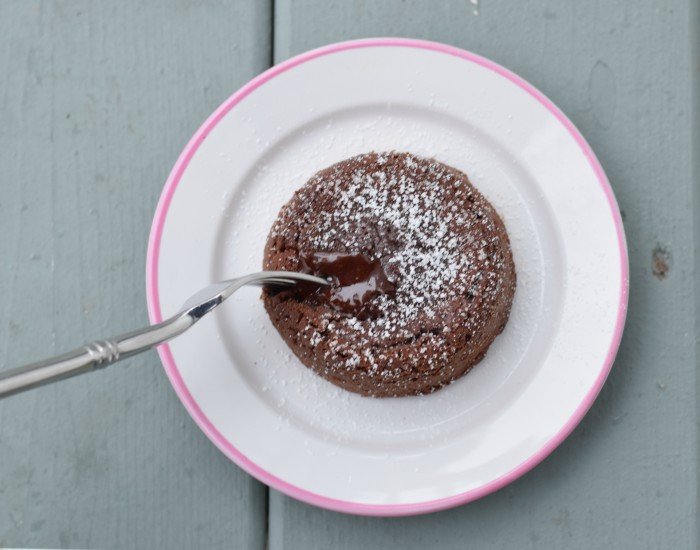 Bite of homemade chocolate lava cake recipe