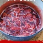 Close up of a pot of finished strawberry syrup.