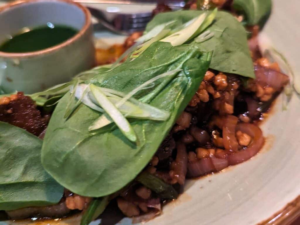 Image shows JiJi Asian Kitchen Chairman Mao Stock Pig on a plate.