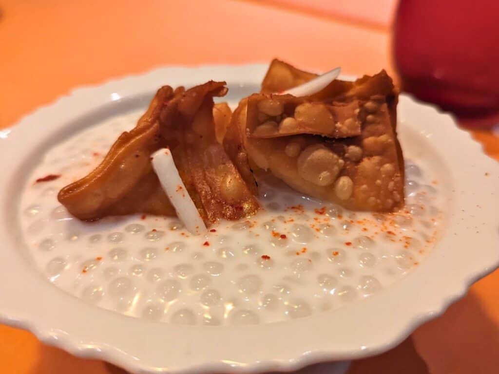 Image shows JiJi Asian Kitchen Fried Wonton dessert in a white fluted bowl.