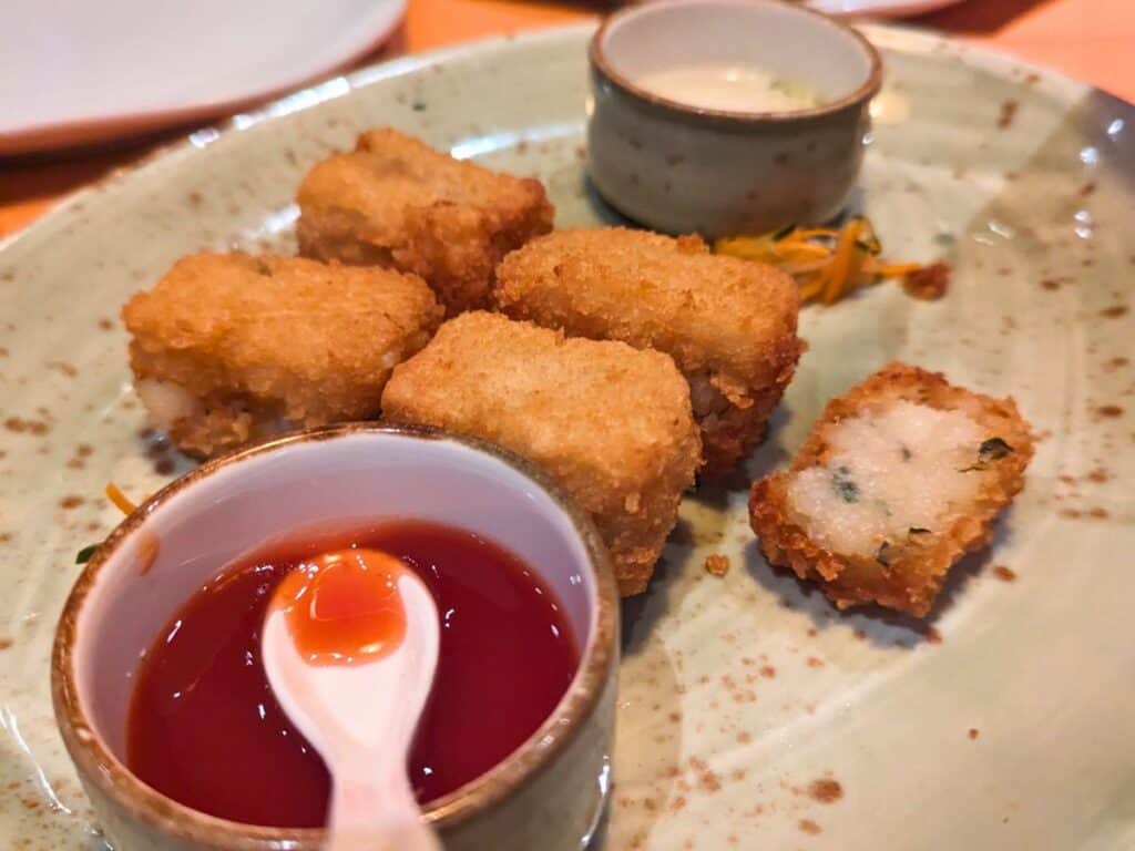 Image shows JiJi Asian Kitchen amuse bouche of potato dumplings.