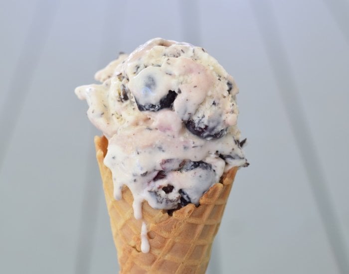Cherry Chip ice cream in a cone with drips.